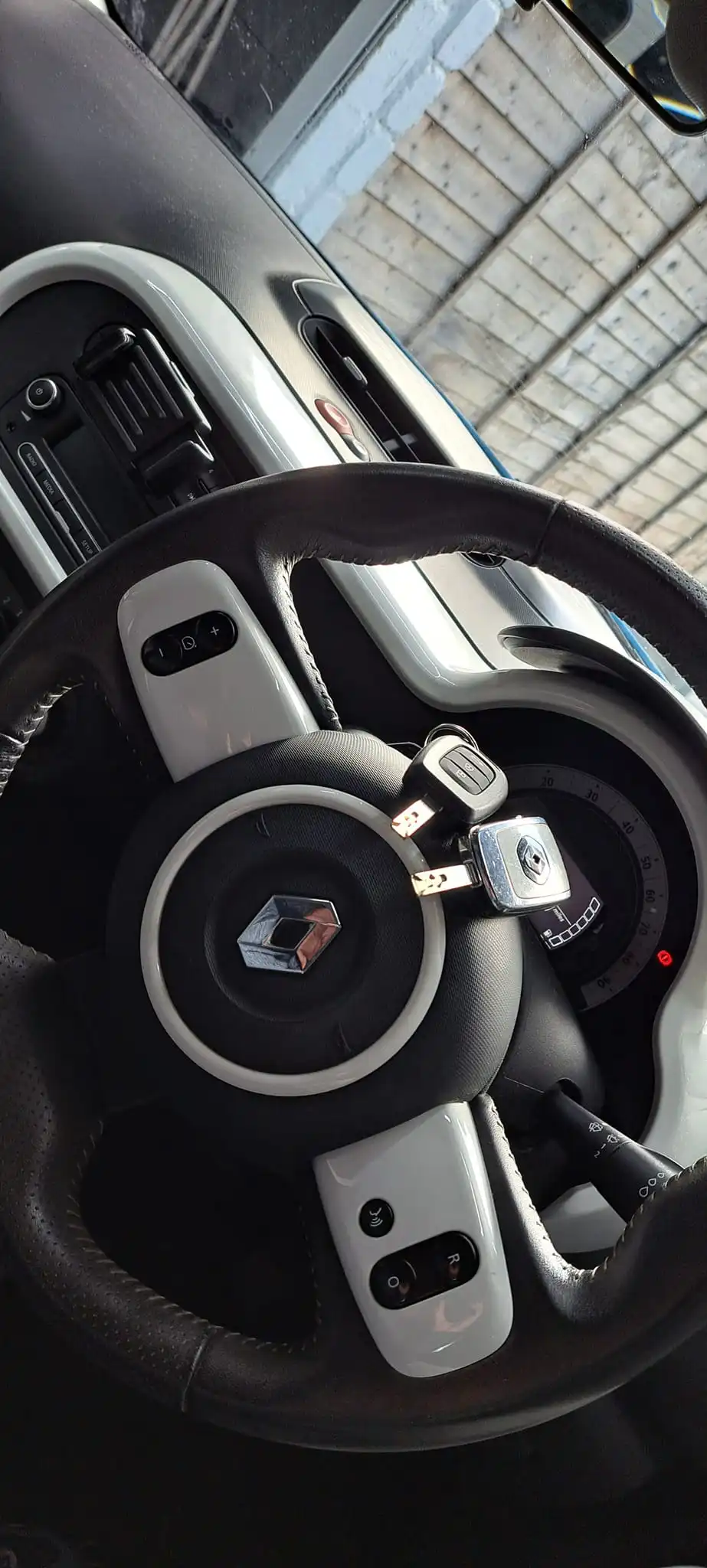 Completed Renault car key replacement job — new key on steering wheel, programmed on-site in Leeds by Motorkeys Auto Locksmiths